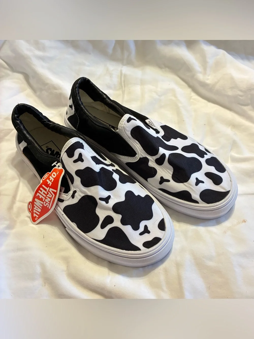 Vans Slip-On Sneakers in Black & White Cow Pattern